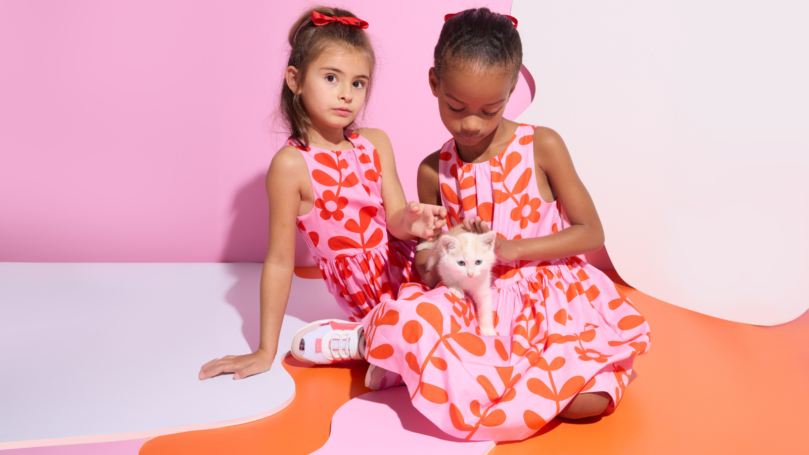 Elegant children wearing timeless Jacadi kidswear including classic dresses and polo shirts in natural setting