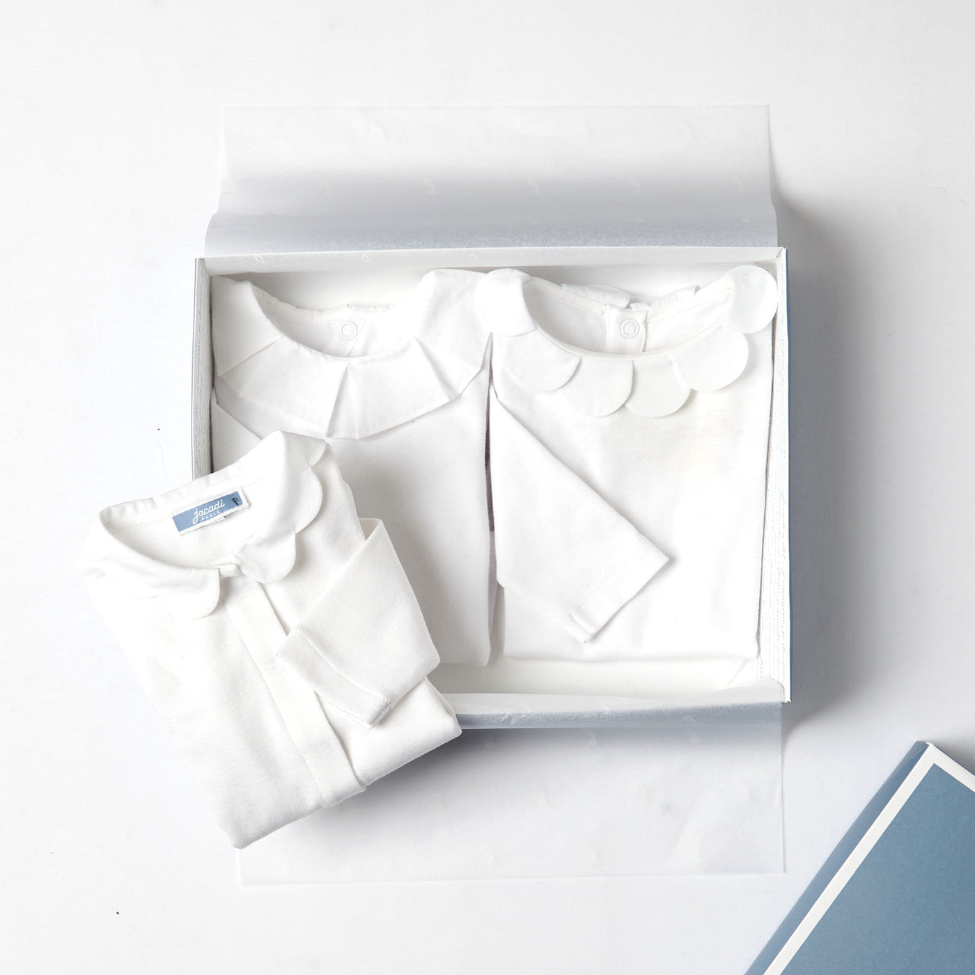 Baby girl bodysuit with petal collar