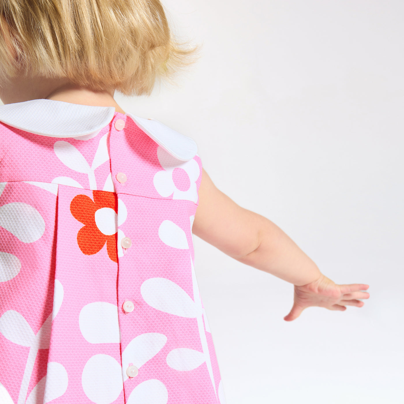 Baby girl dress with plant motif