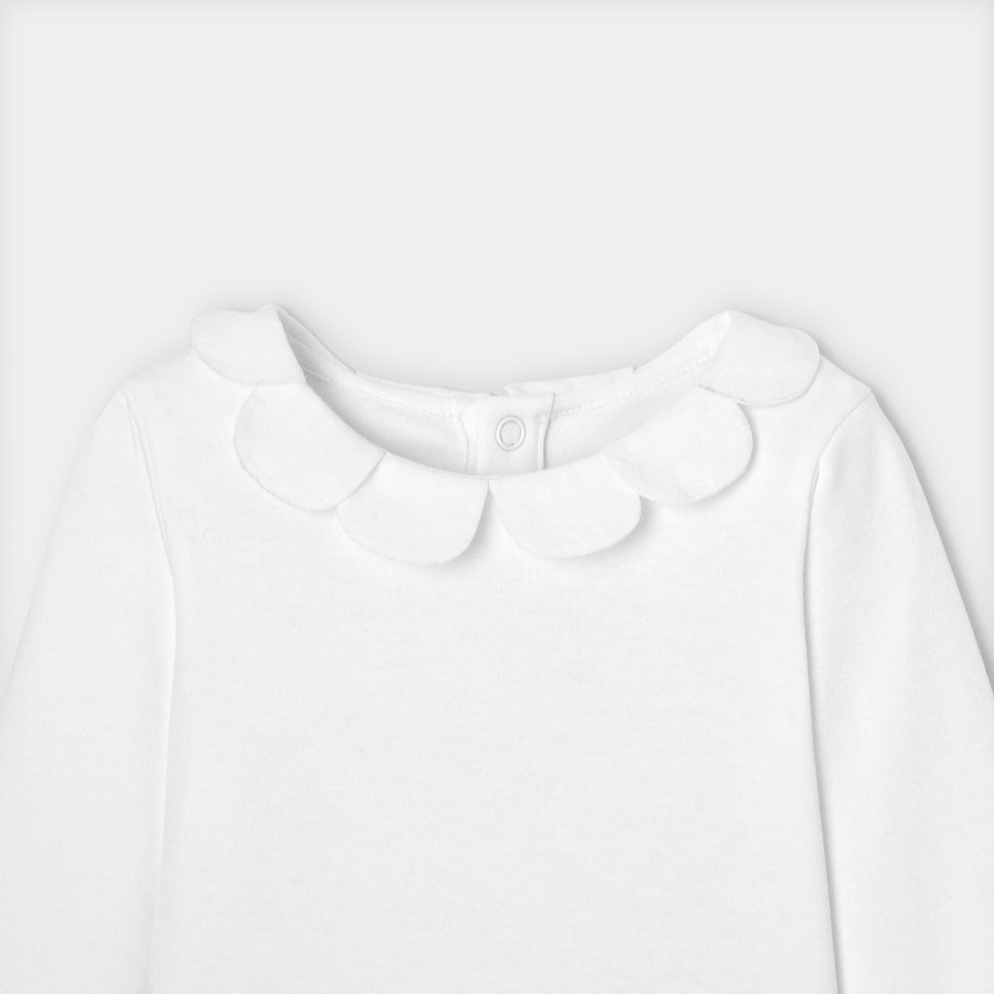 Baby girl bodysuit with petal collar